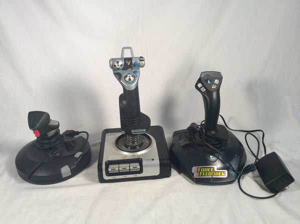 3 vintage joysticks